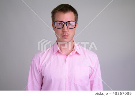 Face of young handsome nerd businessman with eyeglasses 48267089