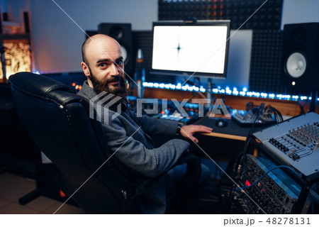 Bearded sound engineer in audio recording studio 48278131