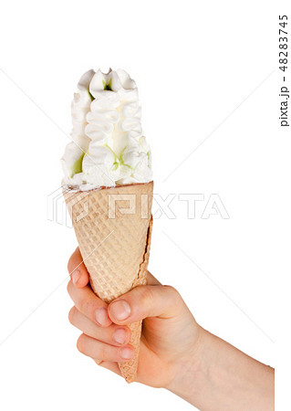 Ice cream cone in child's hand isolated on white background 48283745