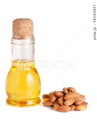 Bottle of almond oil and almonds isolated on white background 48284847