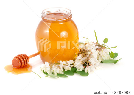 Jar of honey with flowers of acacia isolated on white background 48287008