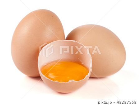 two whole eggs and broken egg isolated on white background 48287558