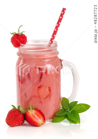 Glass of strawberry smoothie with mint leaves isolated on white background 48287723