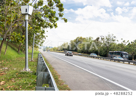 Speed trap surveillance camera along highway Speed trap surveillance camera along highway 48288252