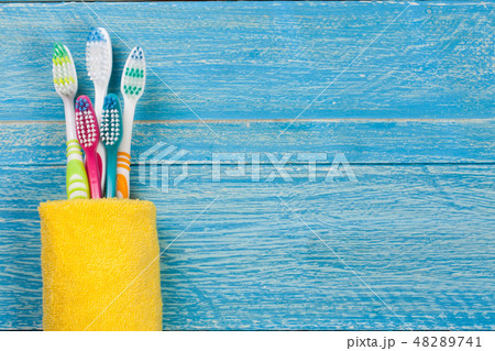 toothbrushes on the blue wooden background with copy space for your text. Top view 48289741