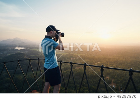 Photographer on the top of Sigiriya rock Photographer on the top of Sigiriya rock 48297870