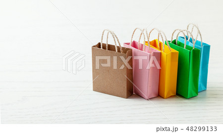 Colored shopping bags on white background. Copy space for text. 48299133