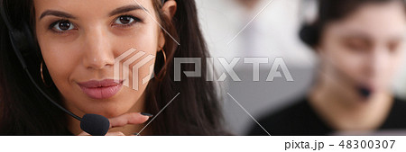 Three call centre service operators at work 48300307