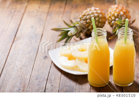 bottles of pineapple juice with fresh fruits bottles of pineapple juice with fresh fruits 48301510