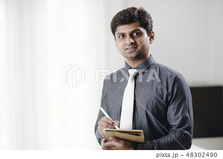 Businessman with tablet computer Businessman with tablet computer 48302490