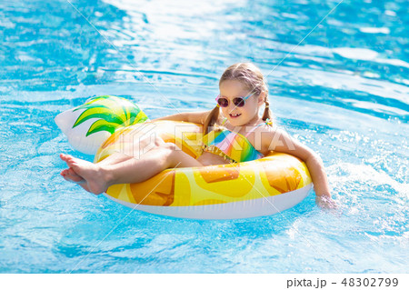 Child in swimming pool. Summer vacation with kids. 48302799