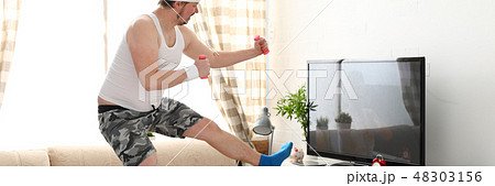 Young handsome man in shorts and 48303156