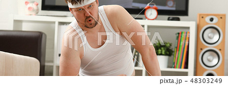 A young handsome man with excess weight 48303249