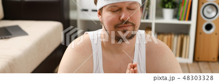 A young man practicing yoga and Pilates A young man practicing yoga and Pilates 48303328