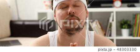 A young man practicing yoga and Pilates A young man practicing yoga and Pilates 48303330