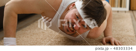 A young handsome man with excess weight 48303334