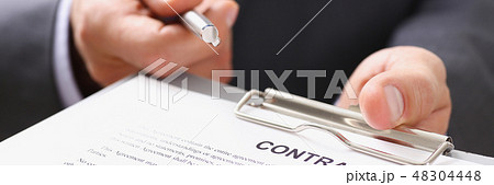 Male arm in suit offer contract form on 48304448