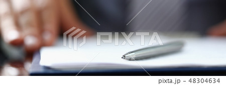 Male arm in suit offer contract form on 48304634