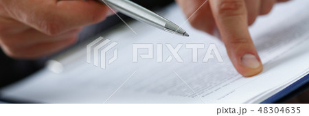 Male arm in suit offer contract form on 48304635