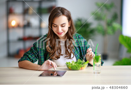 healthy eating. happy young girl eating salad  48304660