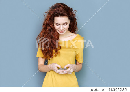 Joyful pretty woman talking with her friends Joyful pretty woman talking with her friends 48305286