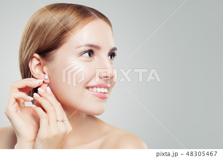 Women earring jewelry model. Cheerful woman Women earring jewelry model. Cheerful woman 48305467