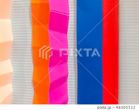 Colored paper strips decorate on board 48305512