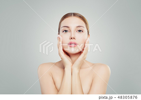 Beautiful model woman touching her face 48305876