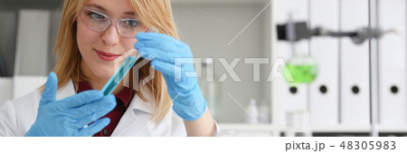 Technician hold in arms in protective gloves Technician hold in arms in protective gloves 48305983