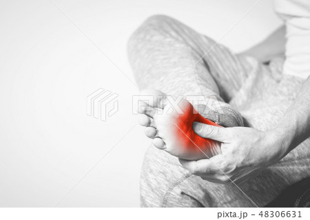 man with pain in foot man with pain in foot 48306631