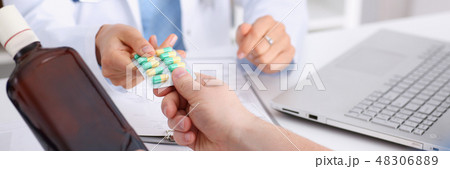 Alcoholic hold in arm empty bottle and medication Alcoholic hold in arm empty bottle and medication 48306889