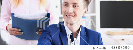 Smiling man and woman shake hands Smiling man and woman shake hands 48307590