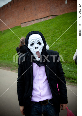 Man in scary mask in a street 48308732