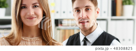 Beautiful smiling cheerful girl at workplace 48308825