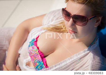 Portrait of young blonde woman at summer 48309063