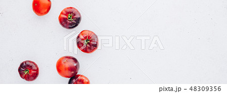 Tomatoes Mar Azul on white wooden table background Tomatoes Mar Azul on white wooden table background 48309356