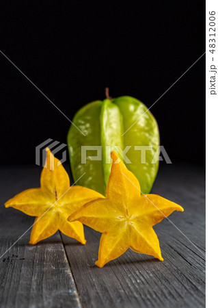 Slices of ripe star fruit carambola or star apple 48312006