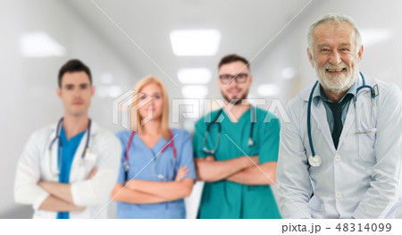 Doctor working in hospital with other doctors. Doctor working in hospital with other doctors. 48314099