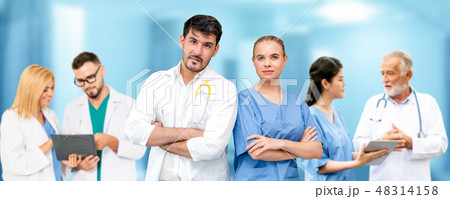 Doctor working in hospital with other doctors. Doctor working in hospital with other doctors. 48314158