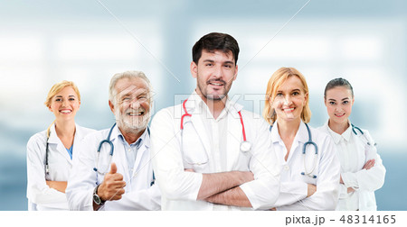 Doctor working in hospital with other doctors. 48314165