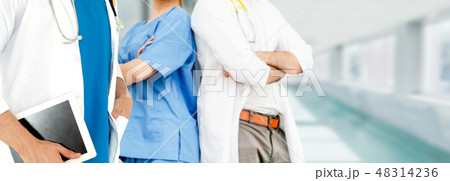 Doctor working in hospital with other doctors. Doctor working in hospital with other doctors. 48314236