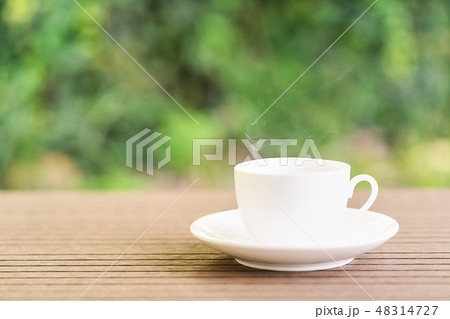 White ceramic coffee cup on table 48314727