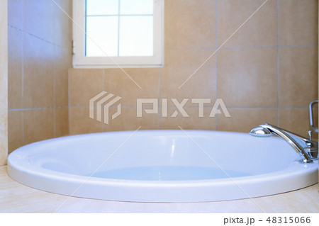 Modern bathtub full of water 48315066