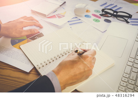 Businessman or accountant working on calculator to Businessman or accountant working on calculator to 48316294