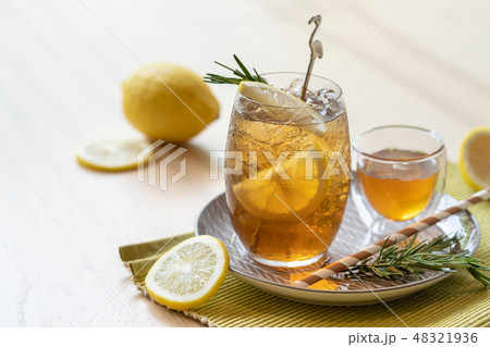 Iced tea with lemon and honey on plate, refreshing Iced tea with lemon and honey on plate, refreshing 48321936
