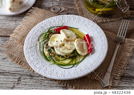 Goat cheese pickled with crow garlic and peppers 48322436