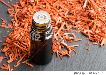 A bottle of sandalwood essential oil A bottle of sandalwood essential oil 48322483