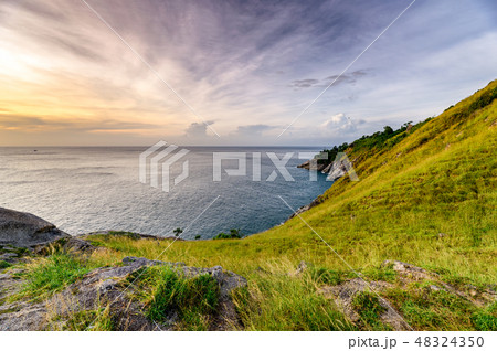 Green hill with horizon sea on coastline 48324350