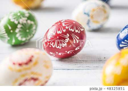 Close-up multicolored easter eggs on wooden table Close-up multicolored easter eggs on wooden table 48325851