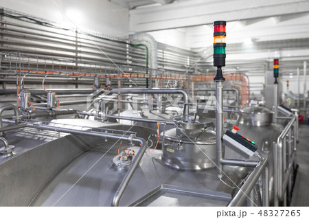 Chrome pipes and traffic lights. Industrial background Chrome pipes and traffic lights. Industrial background 48327265